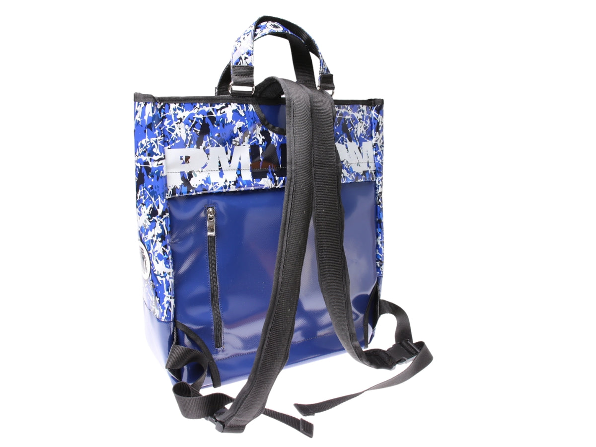 ...2 IN 1 BRIEFCASE AND BACKPACK IN BLUE COLOUR WITH CAMOUFLAGE FANTASY. MODEL HYBRID MADE OF LORRY TARPAULIN.