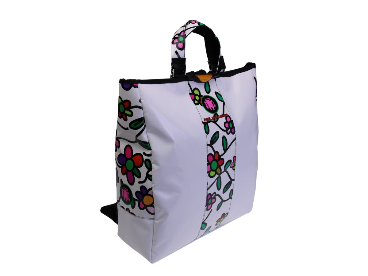 ...2 IN 1 BRIEFCASE AND BACKPACK IN WHITE COLOUR WITH FLORAL FANTASY. MODEL HYBRID MADE OF LORRY TARPAULIN.